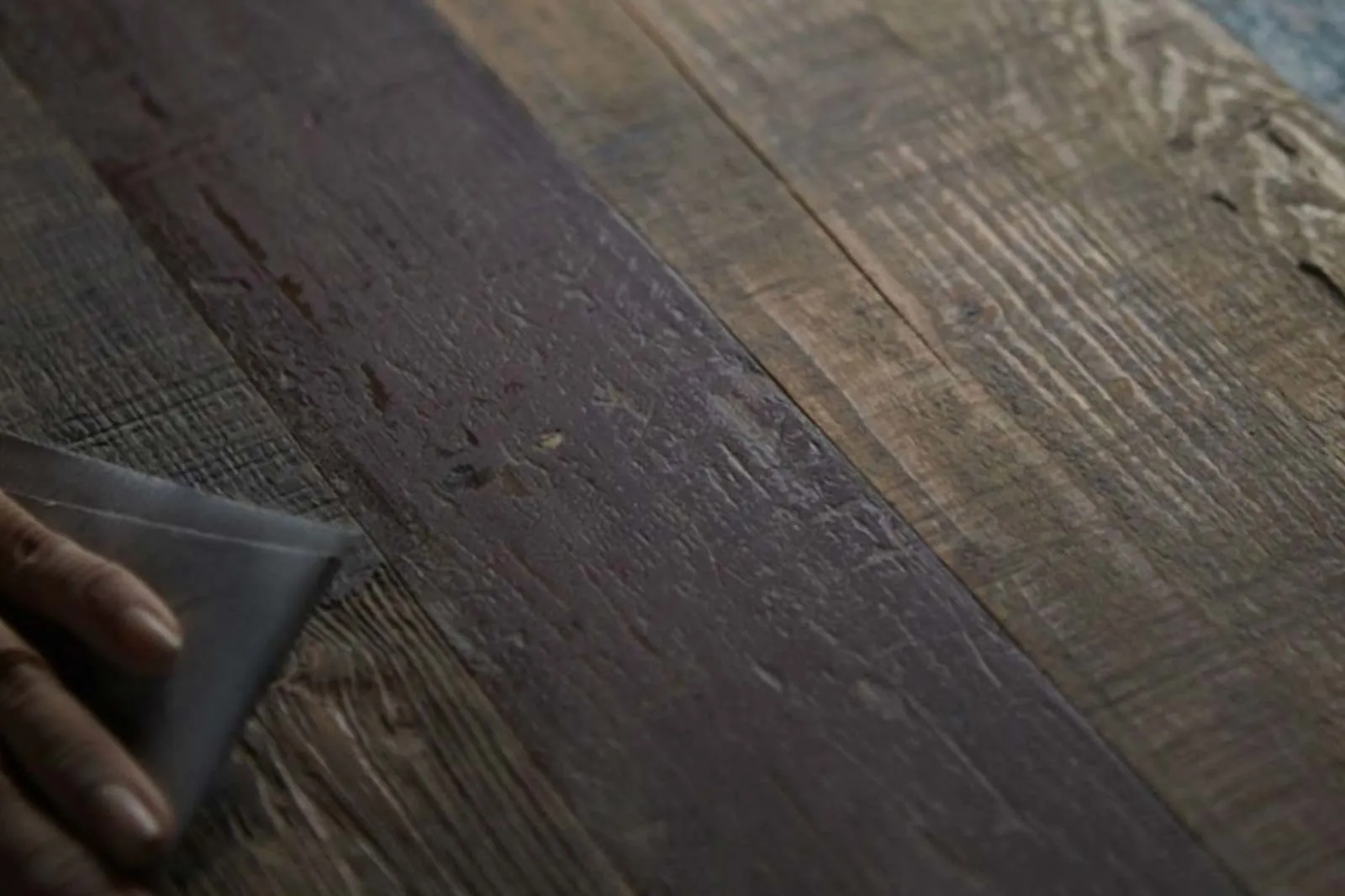 Hand-finishing a reclaimed oak board